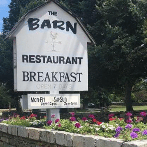 Sign for "The Barn" restaurant serving breakfast every day.