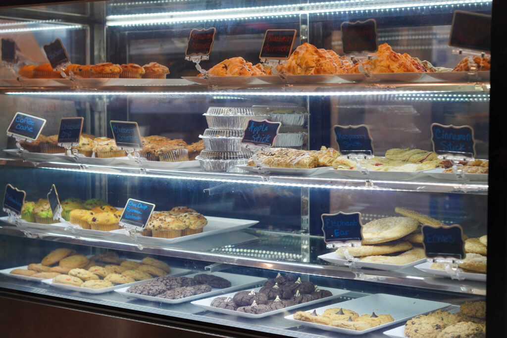 Variety of pastries displayed in bakery shop window