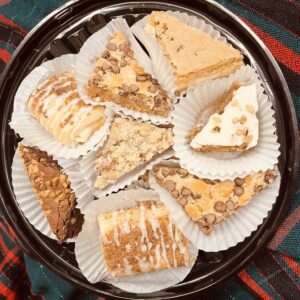 Assorted dessert tray with cakes and pastries.